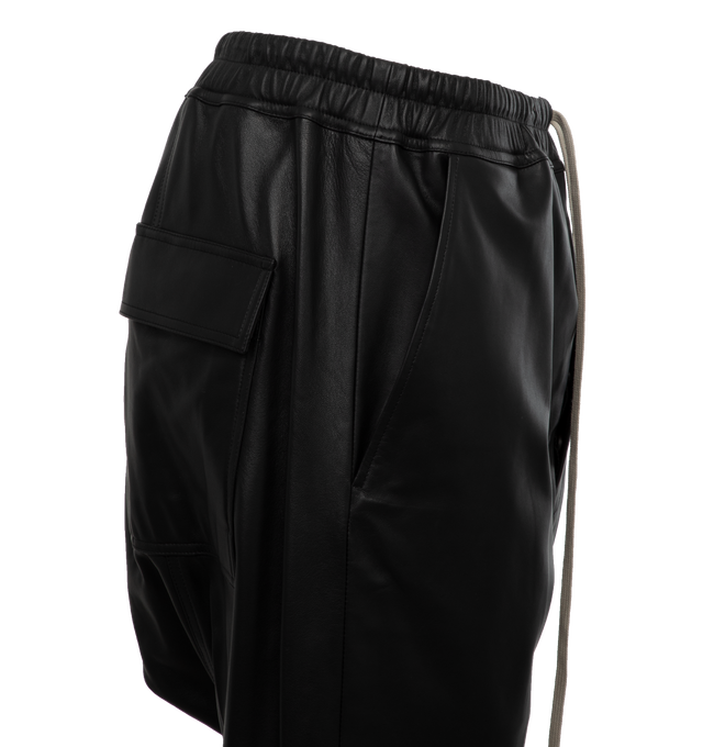 Image 4 of 4 - BLACK - RICK OWENS Cropped Leather Pants featuring paneled construction, drawstring at elasticized waistband, four-pocket styling, button-fly, creased legs, gusset at inseam, full cupro satin lining and horn hardware. 100% lambskin. Lining: 100% cupro. Made in Moldova. 