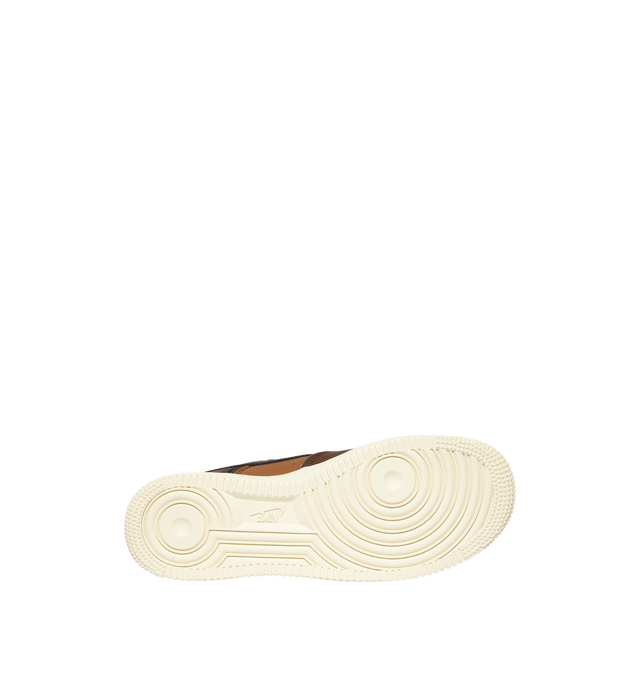 Image 4 of 5 - BROWN - Nike Men's Air Force 1 '07 LV8 Sneaker featuring classic silhouette with genuine and synthetic leather upper with perforated toe box, Nike Air unit, rubber outsole with classic pivot circles and padded collar.