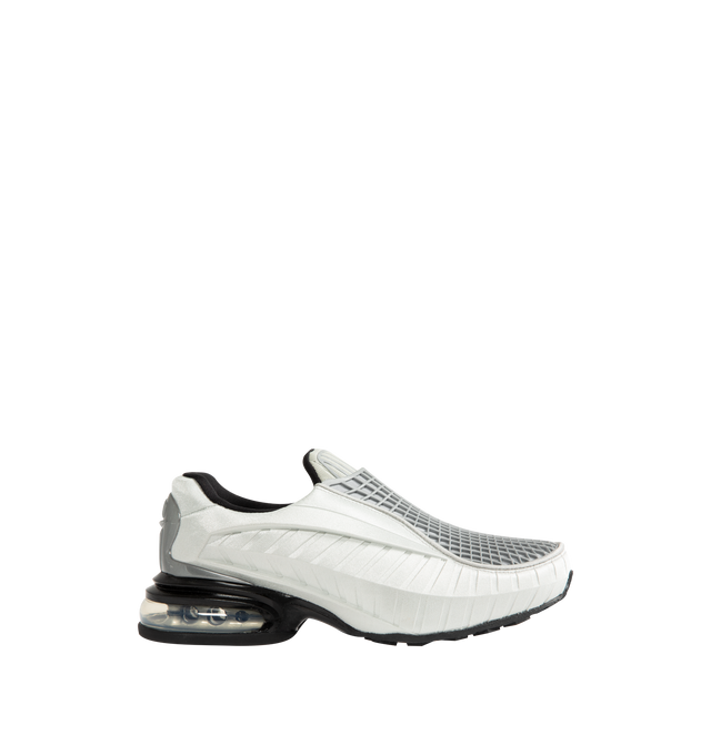 Image 1 of 5 - SILVER - Nike Women's Air Max Dolce features a laceless molded upper with an overlay cage and the signature Air Max silhouette. This streamlined design is detailed with visible Air cushioning in the heel for comfort and a distinctive profile. Designed as a versatile slip-on style. Upper: 70% Calf Leather, 15% Patent Calf Leather, 15% Fabric. Lining: 100% Fabric. Sole: 100% Rubber.