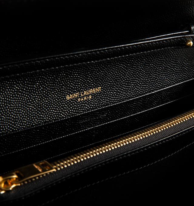 Image 3 of 3 - BLACK - SAINT LAURENT Chain Wallet Bag featuring detachable chain, gold-toned brass hardware, snap Button closure, ten card slots, bill slot, two central compartments and one interior zipped pocket. 8.9 x 5.5 x 1.6 inches. Calfskin leather. Made in Italy.