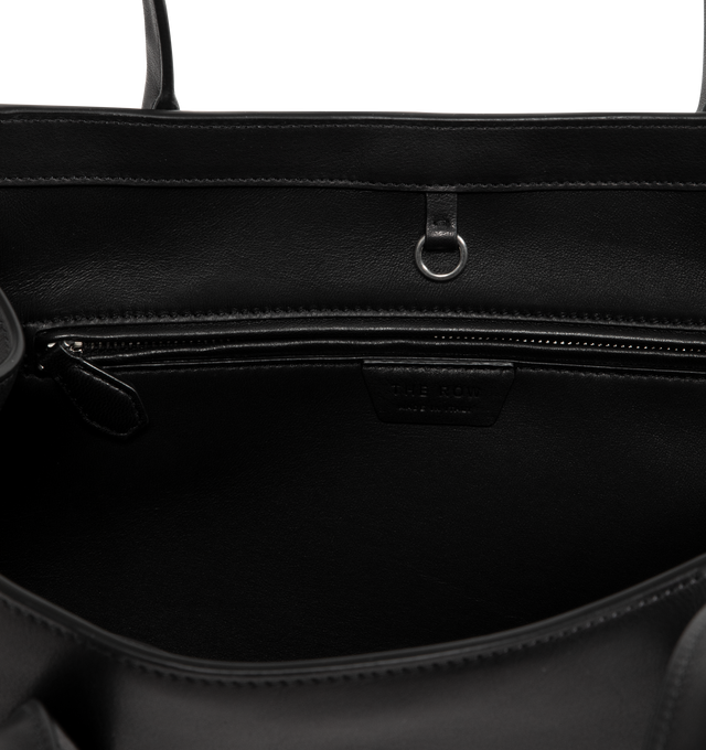 Image 3 of 3 - BLACK - The Row Alger Geometric shoulder bag in polished saddle leather with tubular handles, flat base, and hand-stitched construction. 100% Calfskin Leather lined in 100% Lambskin Leather. Made in Italy.