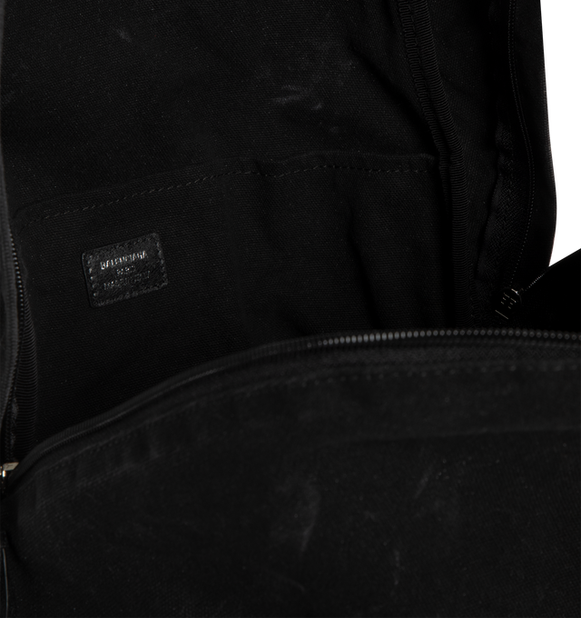 Image 3 of 3 - BLACK - BALENCIAGA Editor Backpack featuring one top handle, adjustable shoulder straps, Balenciaga logo printed at front. aged-silver hardware, front zipped pocket, zipped closure with with knotted puller, 1 main compartment, 1 inner flat pocket and Balenciaga logo engraved zipper puller. Cotton canvas lining. L13.3 x H18.1 x W6.3 inch. Cotton, lambskin, polyester. Made in Italy.