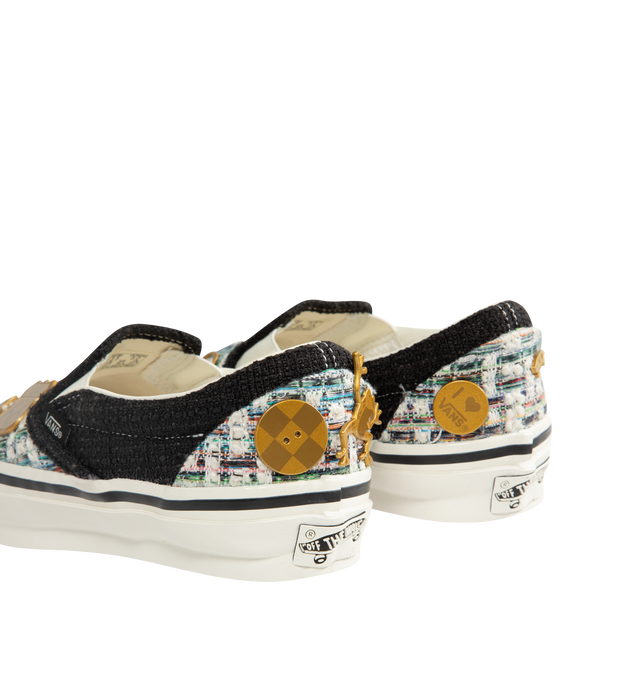 Image 3 of 5 - BLACK - Vans iconic slip-on shoe crafted from midweight canvas adorned with metal pins with rhinestones and crystal studding. Elevated design featuring higher sidewalls with gloss finish, enhanced cushioning and padded collar for support and all-day comfort. Elastic side panels for easy slip-on and off. Sola Foam ADC (All-Day Comfort) insole for soft and durable cushioning. Signature waffle outsole pattern for reliable grip.