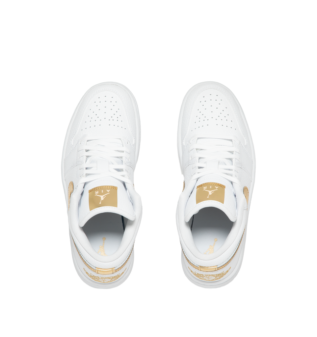 Image 5 of 5 - GOLD - Women's Air Jordan 1 Low SE Sneakers feature a genuine leather upper with signature stitched overlays, a low-top silhouette, and iconic Wings branding for a timeless look. These lifestyle sneakers combine lightweight Air-Sole cushioning, a supportive cupsole construction, and a durable rubber outsole for everyday comfort, stability, and reliable traction. Main Material: Genuine Leather. Midsole: Foam with Air-Sole Unit. Sole: Rubber.