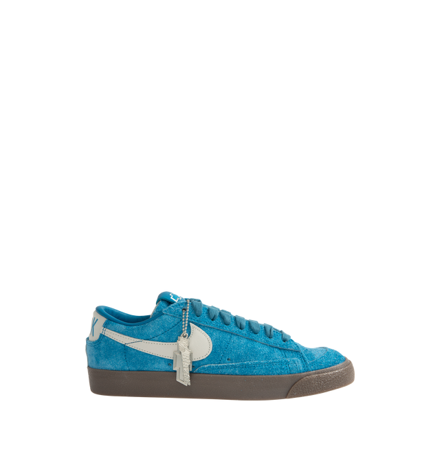 Image 1 of 5 - BLUE - NIKE Blazer Low Devin Booker Chevrolet Team Sneaker featuring supple leather upper in a vibrant hue, signature Booker details, including his jersey number on the heel, low-top silhouette, foam midsole and rubber outsole.