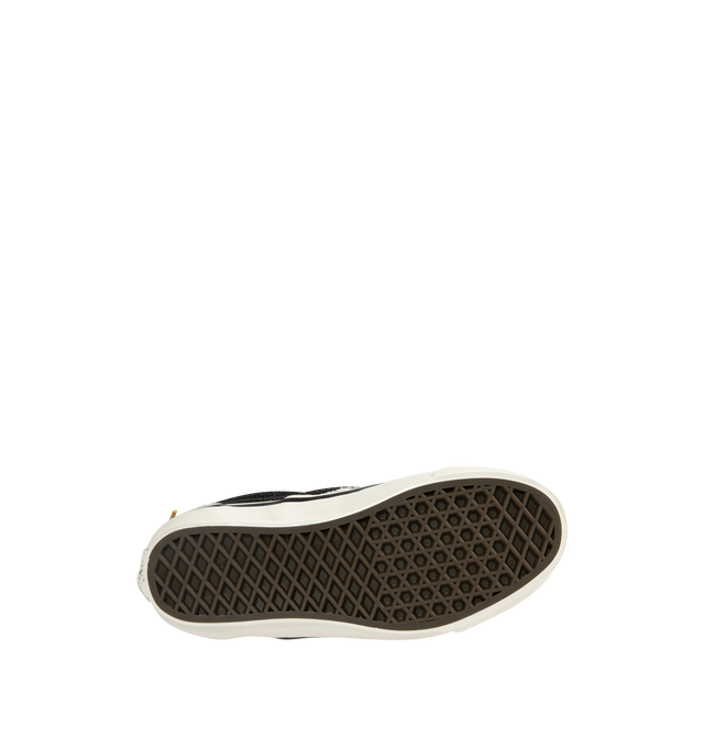 Image 4 of 5 - BLACK - Vans iconic slip-on shoe crafted from midweight canvas adorned with metal pins with rhinestones and crystal studding. Elevated design featuring higher sidewalls with gloss finish, enhanced cushioning and padded collar for support and all-day comfort. Elastic side panels for easy slip-on and off. Sola Foam ADC (All-Day Comfort) insole for soft and durable cushioning. Signature waffle outsole pattern for reliable grip.