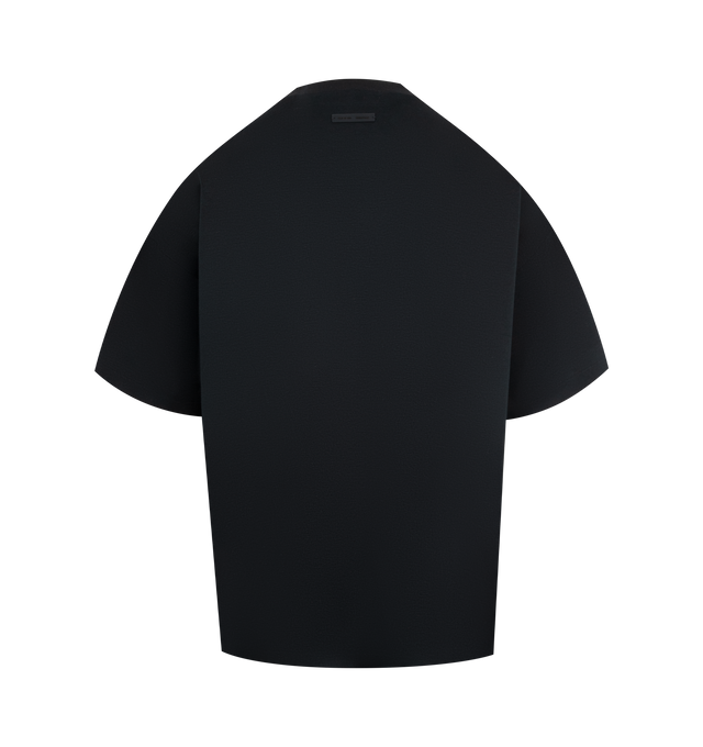 Image 2 of 2 - BLACK - FEAR OF GOD ESSENTIALS 90s Tee featuring an oversized 90s-inspired silhouette, exaggerated proportions with dropped shoulders for a relaxed drape, matte HD print application on front, "26" graphic on back, and signature rubberized Fear of God Essentials label at the collar. 100% cotton jersey.