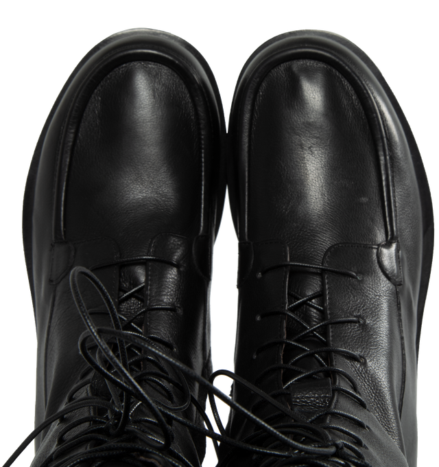 Image 4 of 4 - BLACK - THE ROW Patty Boot featuring vegetable tanned calfskin leather with lace-up front, stitched toe box and slim, supple shaft. 100% leather. Rubber sole. Made in Italy. 