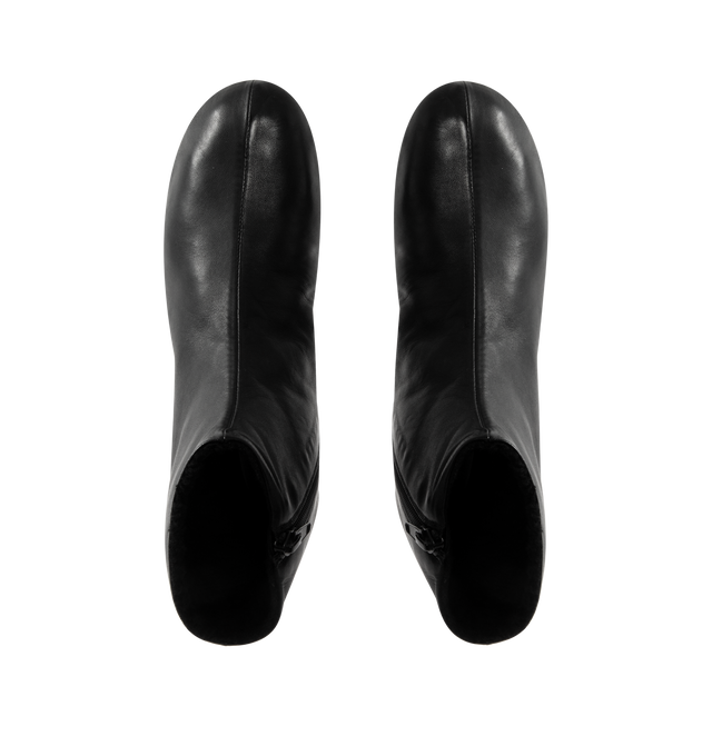 Image 4 of 4 - BLACK - THE ROW Stella Boot featuring minimal ankle boot in smooth nappa leather with inner side zip closure, soft shearling lining and flexible rubber-coated sole. 100% lambskin leather. Synthetic sole. Made in Italy.
