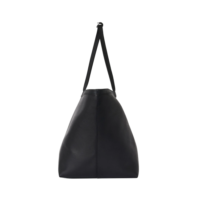 Image 3 of 3 - BLACK - THE ROW XL Stitched Park Tote Bag featuring classic tote bag in polished saddle leather with interior tie closure, textured calfskin leather trim and removable interior wristlet with adjustable strap. 23 x 11.75 x 13.75 in. Handle: 10.5 in. drop. Antique silver hardware finishing. 100% calfskin leather. Lined in 100% lambskin leather. Made in Italy.