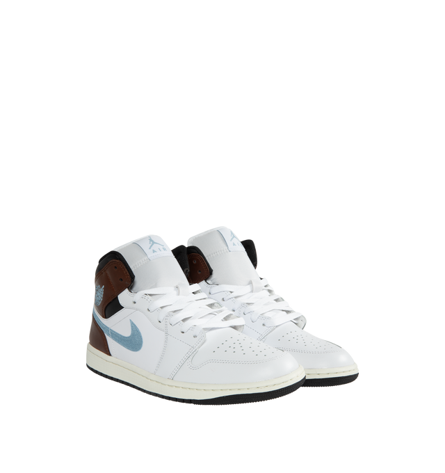 Image 2 of 5 - WHITE - AIR JORDAN 1 MID SE basketball shoe featuring an angled profile, encapsulated Air cushioning underfoot, embroidered Swooshes and distinctive Jordan detailing. Air-Sole cushioning provides lightweight, responsive comfort.  Leather and textile upper/synthetic lining/rubber sole. 