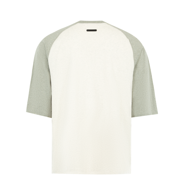 Image 2 of 2 - NEUTRAL - FEAR OF GOD ESSENTIALS Signature Baseball Tee featuring medium-weight cotton jersey, rib-knit crewneck tee, an oversized fit with baseball-inspired 3/4 raglan sleeves that contrast in color, an embroidered Essentials signature logo on front and an Essentials signature label at the back collar. 100% cotton.