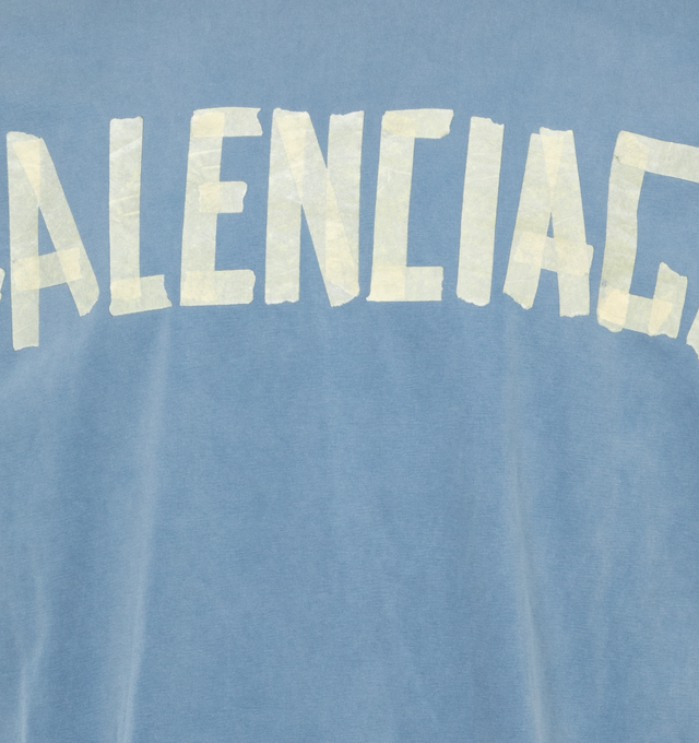 Image 3 of 4 - BLUE - BALENCIAGA Tape Type T-Shirt Medium Fit featuring vintage jersey, crewneck, short sleeves, tape Type logo at front and back and worn-out and washed-out effect. 100% cotton. Made in Portugal. 