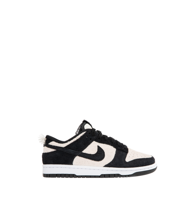 Image 1 of 5 - WHITE - NIKE Dunk Low Retro SE Sneaker featuring iconic Panda colorblocking in a hairy suede iteration, paired with plush padding, foam midsole offers lightweight, responsive cushioning, rubber outsole with classic pivot circle, low-cut collar and hairy Panda tag.