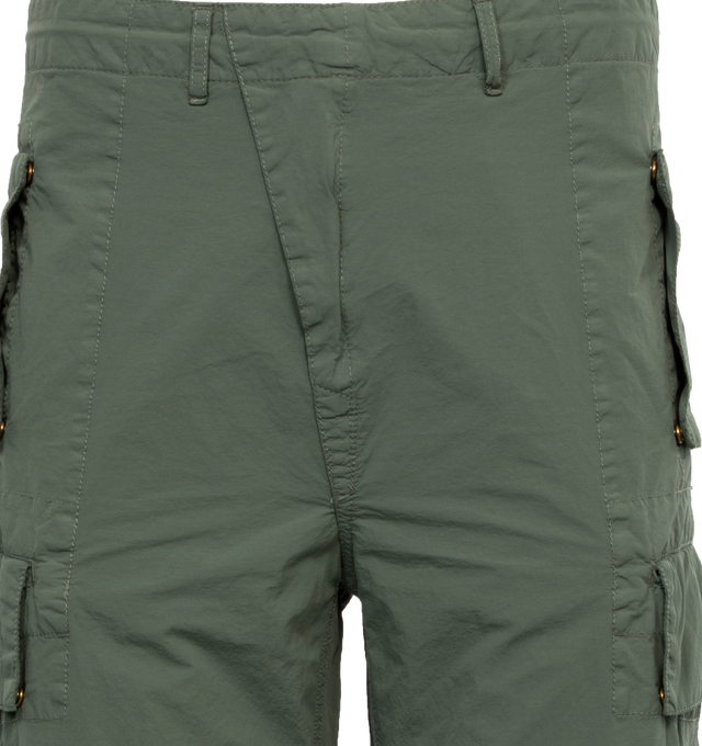 Image 4 of 4 - GREEN - C.P. COMPANY Flatt Nylon Oversized Cargo Pants featuring oversized fit, zip fly and button fastening, belt loops, slanted hand pockets, cargo pockets and lens detail. 100% polyamide/nylon. 