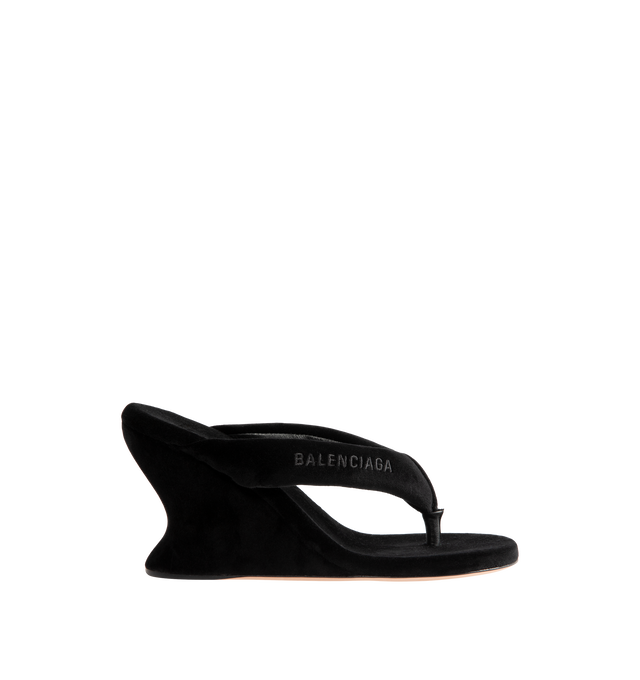 Image 1 of 4 - BLACK - Balenciaga Womens Gaeta Wedge Thong Sandals are crafted from a plush stretch velvet material. Feature a round toe, padded thong strap, slip-on design, 90mm arch wedge heel, and leather sole. Upper: cotton, viscose, elastane, Sole: calfskin, Insole: cotton, viscose, elastane. Made in Italy.