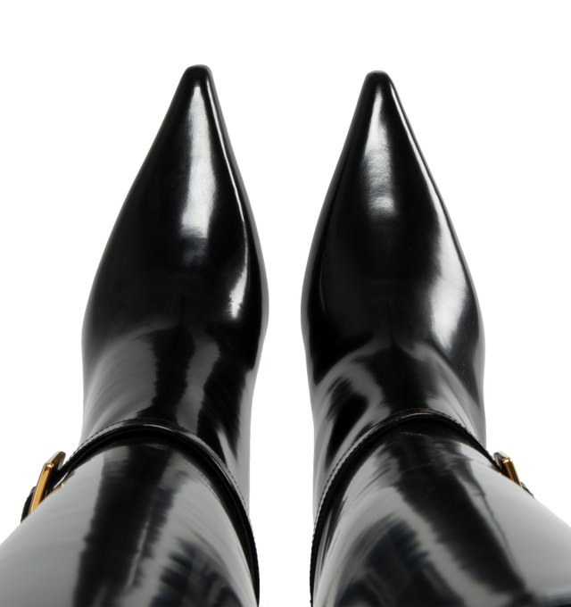 Image 4 of 5 - BLACK - Saint Laurent tube boots with pointed toe and 7cm high stiletto heel featuring a metallic buckle strap at the ankle. 100% calfskin leather with leather sole.  Made in Italy. 