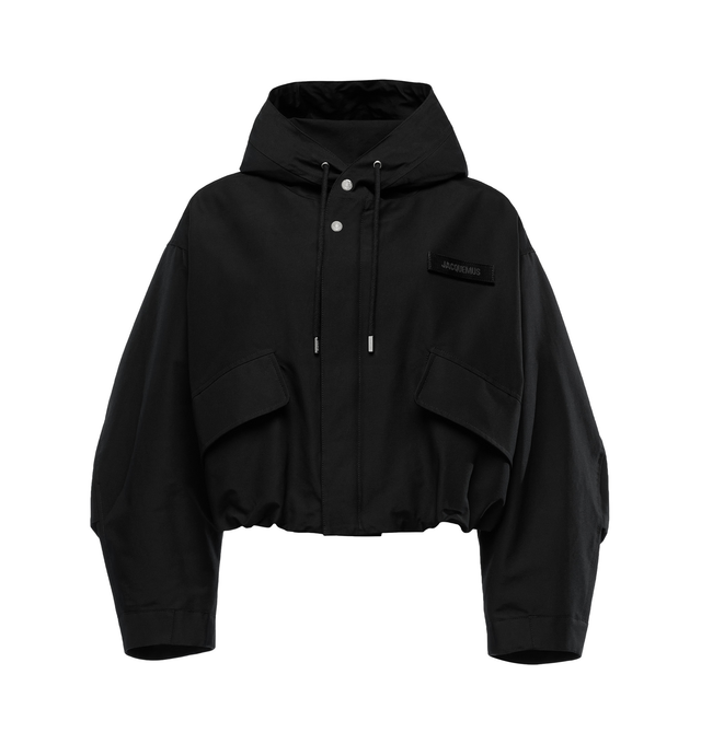 Image 1 of 1 - BLACK - JACQUEMUS La Parka Courte Caraco Jacket featuring water-repellent nylon canvas, drawstring at hood, zip closure with press-stud placket, velcro logo patch at chest, flap pockets, concealed bungee-style drawstring at cropped hem, button tab at cuffs, full sateen lining and logo-engraved silver-tone hardware. 100% polyamide. Made in Tunisia. 