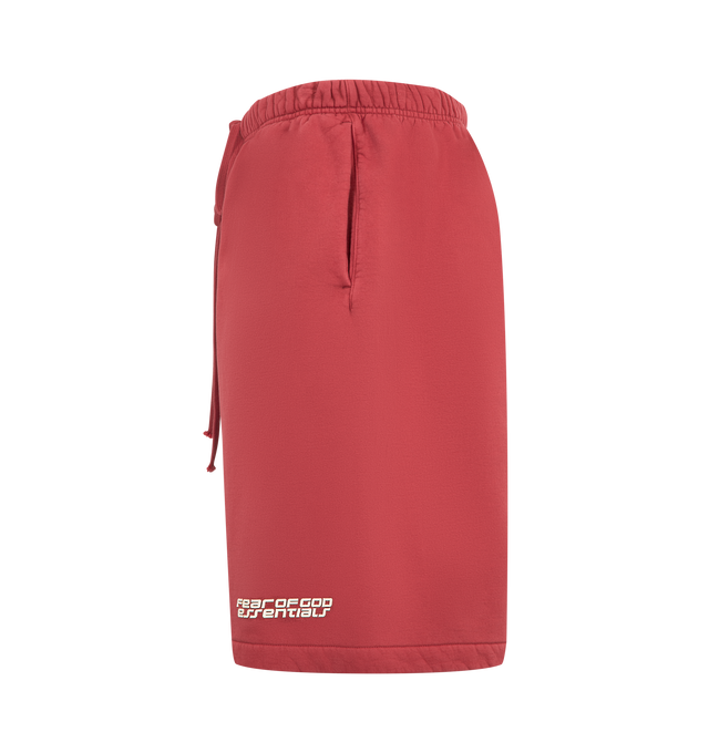 Image 3 of 3 - RED - FEAR OF GOD ESSENTIALS Relaxed Sweatshort featuring 520gsm heavy fleece treated with a pigment dye, wide-leg silhouette, bold Fear of God Essentials HD print graphic, encased elastic waistband with elongated drawcords, side seam pockets and a Fear of God Essentials rubberized label stitched at the center front. 100% cotton.