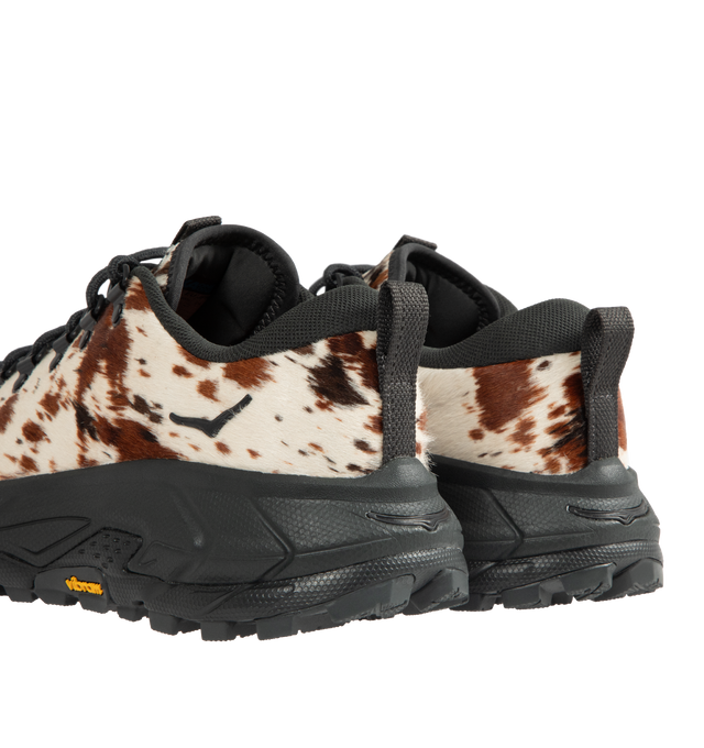 Image 3 of 5 - BROWN - HOKA Tor Summit+ Pony Hair Sneaker featuring pony hair leather upper, metal eyelets + hiking-style lacing system, Vibram Megagrip outsole for traction on varied terrain, cushioned midsole for long-wear comfort, pull tabs at heel and tongue for easy entry and ;ow-cut hiking silhouette.