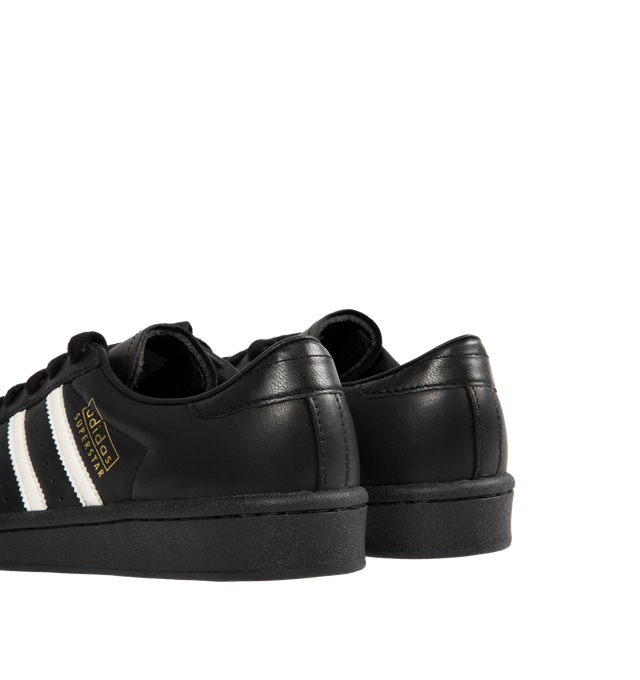Image 3 of 5 - BLACK - ADIDAS Superstar Vintage Sneakers featuring a shell toe, 3-Stripes on side, heel tab, leather upper, lining and insole and rubber outsole.