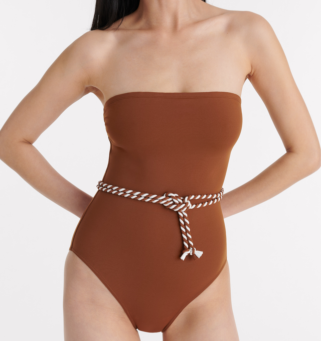 Image 5 of 5 - BROWN - ERES Majorette One-Piece Bustier Swimsuit featuring two-tone twisted belt to tie at the waist, gripper tape and side shirring. 84% Polyamid, 16% Spandex. Made in Morocco. 
