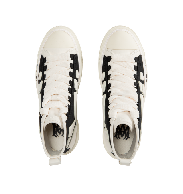 Image 5 of 5 - BLACK - AMIRI Skel Court Hi Sneakers featuring high-top cotton canvas and buffed leather sneakers, rubber cap toe, lace-up closure, logo embossed at tongue, pull-loop at heel collar, graphic appliqus at sides, logo embossed at outer midsole and treaded rubber sole. Upper: textile, leather. Sole: rubber.