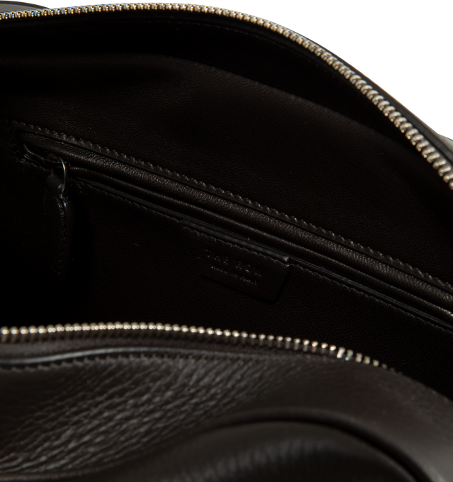 Image 3 of 3 - BROWN - The Row Women's Small E/W India Bag is crafted from textured calfskin leather and features an elongated bowling-bag silhouette, extended tubular top handles, a branded metal padlock and key, and a top zip closure. Designed for everyday use, this compact style is lined in lambskin leather and offers a streamlined profile for carrying daily essentials. Main Material: 100% Calfskin Leather. Lining: 100% Lambskin Leather. Dimensions: 29 x 15 x 11 cm / 11.4 x 5.9 x 4.3 in. Details: Extende