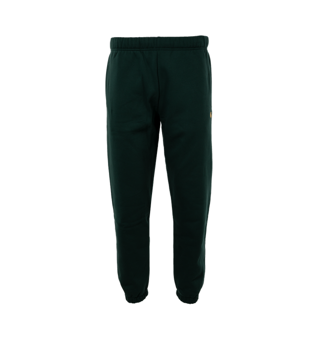 Image 1 of 4 - GREEN - CARHARTT WIP chase sweat pant is constructed from a brushed, cotton-polyester blend, which offers warmth and comfort. The garment also features an adjustable waistband and a back pocket, and is accented by subtle branding in the form of an embroidered 'C' logo. Loose fit. 