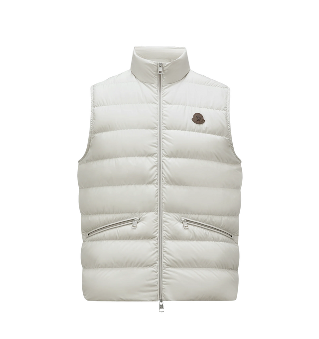 Image 1 of 3 - WHITE - MONCLER Treompan Down Vest featuring lightweight micro chic lining, down-filled, collar with snap button closure, zipper closure, zipped pockets and leather logo. 100% polyester. Padding: 90% down, 10% feather.