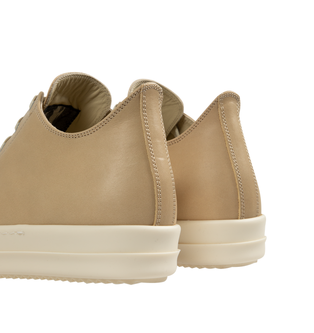 Image 3 of 5 - NEUTRAL - Rick Owens Low Sneaks Sneakers featuring low-top, vegetable-tanned spalla leather, LWG-certified leather, calfskin cap toe, lace-up closure, eyelets at inner side, buffed calfskin lining and treaded rubber sole. Upper: leather. Sole: rubber. Made in Italy.