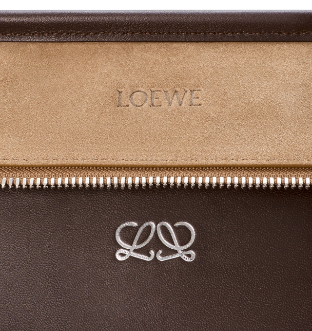 Image 13 of 16 - BROWN - Loewe Mens Amazona 180 XL Bag is crafted from suede with soft calfskin details. Features a relaxed silhouette, single toron top handle, removable shoulder handle, adjustable crossbody strap, zip closure with two leather pullers, two compartments with concealed magnetic closure, interior flat pocket, side D-ring, suede and nappa lambskin lining, palladium-tone hardware, and embossed LOEWE and Double L branding. Dimensions: 40 31 16 cm; Strap Length: 105133 cm; Strap Drop: 4761 cm;