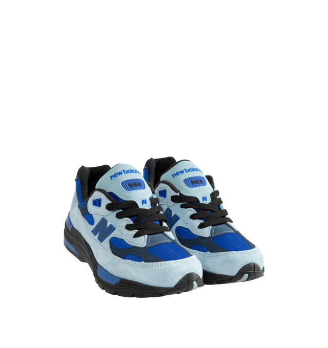 Image 2 of 5 - BLUE - New Balance Unisex Made in USA 992 Sneakers feature a timeless silhouette that blends premium craftsmanship with advanced comfort technology. A fan-favorite since its introduction, this seasonal edition showcases a tonal blue upper crafted from breathable mesh and premium suede overlays, contrasted by a black sole unit. ABZORB cushioning at the heel and forefoot provides exceptional impact absorption, while the ENCAP and C-CAP midsole combination delivers lightweight support and stabil