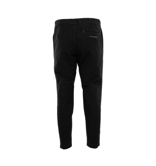 Image 2 of 4 - BLACK - AND WANDER 87 Linen Drawstring Pants featuring elastic waist, side slit pockets, back welt pocket, pleated front and contrast stitching.  