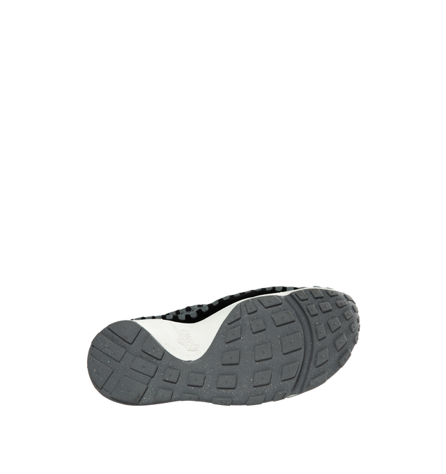 Image 4 of 5 - BLACK - NIKE Air Footscape Sneakers featuring graphic pattern printed throughout, offset lace-up closure, logo embroidered at tongue and heel counter, logo embossed at heel, suede lining, foam rubber midsole and treaded rubber outsole. 