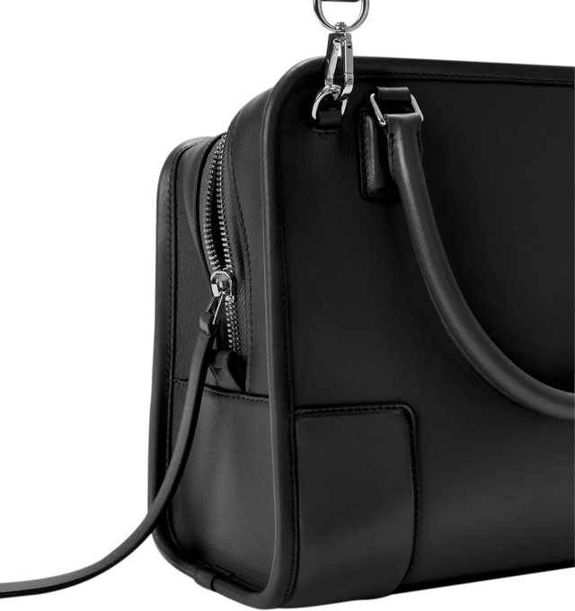 Image 16 of 17 - BLACK - Loewe Amazona Medium 180 Bag in soft calfskin leather featuring a relaxed silhouette with a single toron top handle, designed to be carried open, while a concealed closure secures the main compartment, removable shoulder and crossbody straps, zip closure with two leather zip pullers, two compartments, main compartment closed with magnetic closure, internal flat pocket, suede lining and embossed logo. Soft calfskin. Strap length 108 cm; Strap Drop 50 cm; Handle drop 11 - 28 cm; Heigh