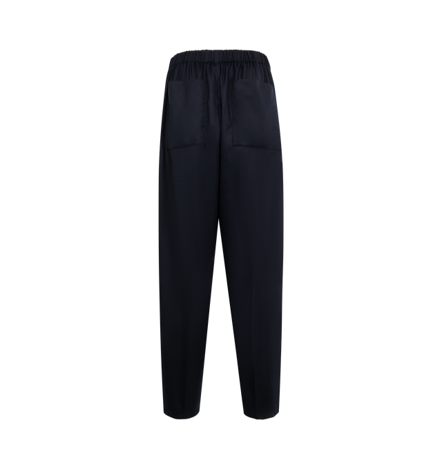 Image 2 of 3 - NAVY - JACQUEMUS Gio Pant featuring mid-high rise, tailoring wool, elastic waistband in the back, three-horn buttoned fly, pressed pleats, wide straight leg, elastic drawstring hem with stoppers and horn beads, back patch pockets and unlined. 100% virgin wool. Lining: 55% cotton, 45% polyester. Made in France.