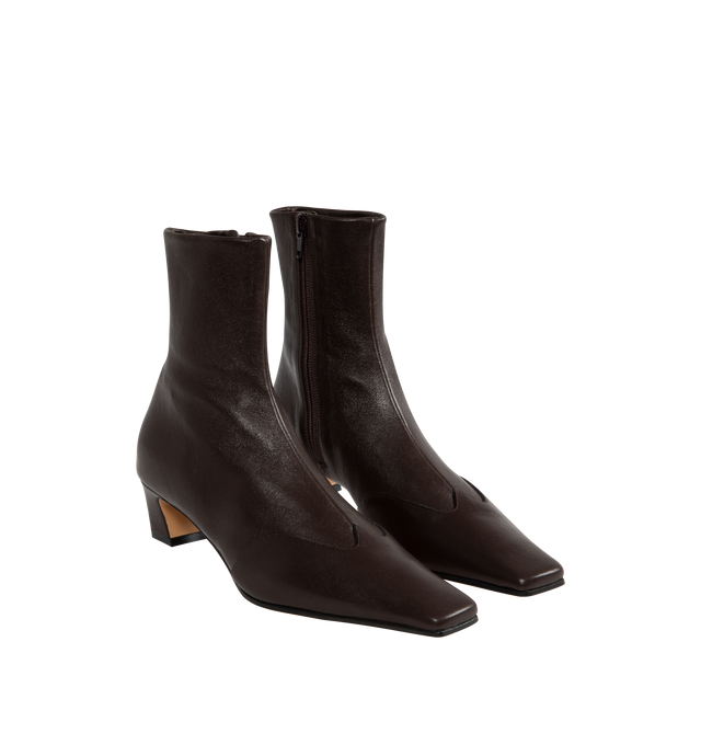 Image 2 of 4 - BROWN - KHAITE Nevada Stretch Low Boot featuring mid-calf urban cowboy boot, calfskin wingtip traced by tonal topstitching, pointed toe and side zipper closure. Heel Height: 1.8 in. 100% lambskin. Made in Italy.