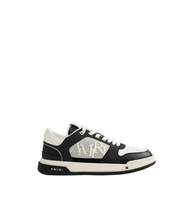 Image 1 of 5 - BLACK - Amiri Men's Classic Low Sneaker is a lace-up style crafted on a rubber sole with leather upper and central panels of molded rubber mesh framing the AMIRI staggered logo. Made in Vietnam. Upper: Leather. Sole: Rubber.