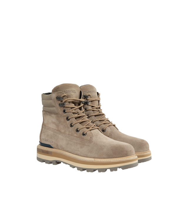Image 2 of 4 - NEUTRAL - MONCLER Peka Trek Boots featuring suede and nylon upper, leather lining insole, lace closure, leather welt, micro rubber midsole and vibram rubber tread. Sole height 5.5 cm. 100% polyamide/nylon. Lining: cow. Sole: 100% elastodiene. 