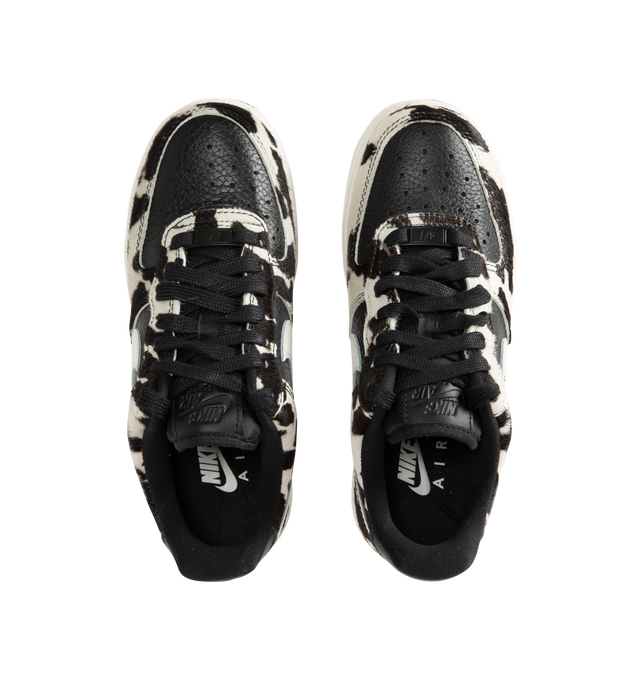 Image 5 of 5 - MULTI - Nike Womens Air Force 1 Low "Cow Print" Sneakers feature a leather upper with cow-print hair overlays. Designed with a lace-up closure, padded collar, perforated toe box, signature Nike Air cushioning, and durable rubber outsole. Upper: Leather with Cow-Print Overlays; Midsole: Nike Air Cushioning; Outsole: Rubber. Imported