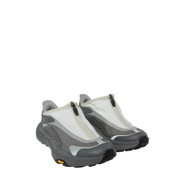 Image 2 of 5 - GREY - Hoka Project Transport Sneakers feature a shrouded ripstop upper with textured synthetic overlays for lightweight durability and a sleek, modern look. Designed for everyday wear, these performance sneakers include a quick-lace system with a zippered shroud, reflective details, signature HOKA cushioning, and a Vibram Ecostep outsole for reliable traction and lasting comfort. Main Material: Ripstop Textile and Synthetic. Sole: Vibram Rubber. Made in Vietnam.