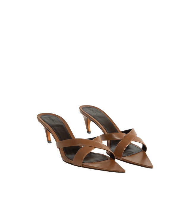 Image 2 of 4 - BROWN - Khaite Women's Sophie Kitten Heel Sandal is crafted from supple goatskin leather and features a minimalist silhouette with crossed straps, a sharply pointed toe, and a sculptural kitten heel. Designed for both elegance and ease, this refined sandal offers exceptional comfort while maintaining its shape through premium kid leather construction. Main Material: Capra Leather (Upper: 100% Kid Leather). Sole: 100% Calfskin Leather. Toe: Pointed. Heel Height: 2.2 in / 5.5 cm. Made in Italy.