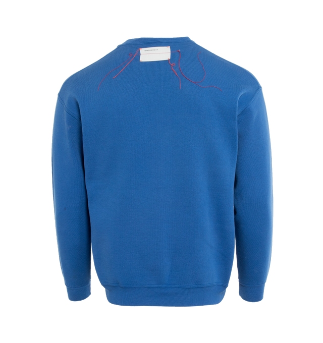 Image 2 of 4 - BLUE - This royal blue upcycled vintage sweatshirt  features "1910" applique at the front and Transnomadica label at the back. 50% cotton / 50% polyester with the size XL on its original vintage label. Measurements: 23 inches in length from neckline to front hem, 23 inches from shoulder-to-shoulder, 24 inches from armpit-to-armpit, 22 inches from top sleeve seam to top of wrist.This collection of vintage sweatshirts, exclusively for 1910 at Hirshleifers, each featuring a hand-crafted 1910 a 
