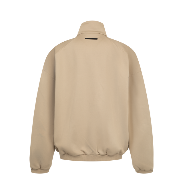 Image 2 of 3 - NEUTRAL - Fear of God ESSENTIALS Men's Tricot Modern Track Jacket is crafted from durable tricot knit and features a modern athletic silhouette with a full-zip front closure and high neckline. Designed for flexibility, comfort, and everyday performance, this elevated track jacket is detailed with dual embroidered logos at the front shoulders, side pockets, rib-knit cuffs and hem, and a signature label at the back. Main Material: 93% Polyester, 7% Elastane Tricot Knit.