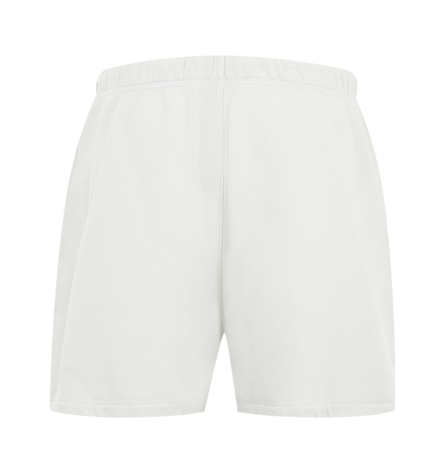 Image 2 of 3 - WHITE - Fear of God Essentials Womens Classic Sweatshorts are crafted from heavyweight cotton fleece with a pigment-dyed finish. Feature a relaxed classic fit, elasticized waistband with adjustable drawcord and bungee, side-seam pockets, and signature Essentials label. Main Material: 100% Cotton. Imported.