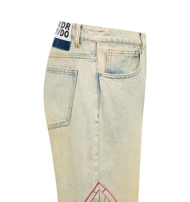 Image 3 of 3 - BLUE - WHO DECIDES WAR Embroidered Jeans featuring non-stretch denim, fading throughout, paneled construction, belt loops, five-pocket styling, zip-fly, logo graphic embroidered at outseams, leather logo patch at back waistband and contrast stitching in tan and pink. 100% cotton. Made in China. 