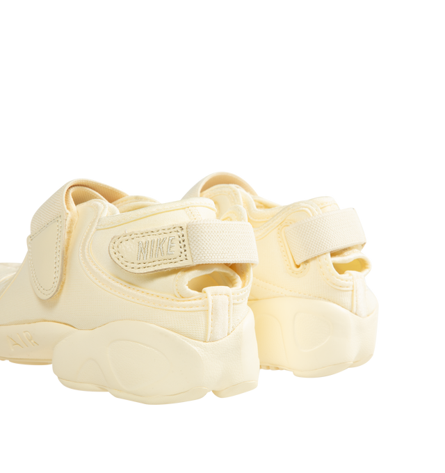 Image 3 of 5 - WHITE - NIKE Air Rift Sneaker featuring hook-and-loop straps on the midfoot and heel, Nike Air unit in the heel combined with plush foam, rubber detailing on the outsole, upper features a blend of elastane, polyester and nylon materials for a flexible fit and split toe design.
