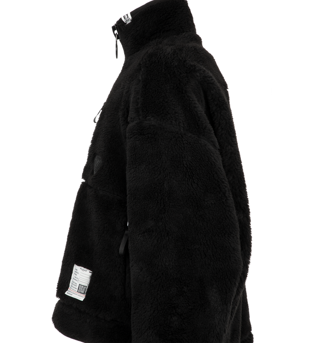 Image 3 of 3 - BLACK - Maison Mihara Yasuhiro Men's Wide Back Boa Blouson is crafted from plush boa fleece and features a relaxed silhouette with a wide back design, full-zip front, and side pockets for a contemporary layered look. This designer fleece jacket combines exceptional warmth with Maison Mihara Yasuhiro's signature oversized aesthetic, making it a standout outerwear piece for colder seasons. Main Material: Boa Fleece. Made in Japan.