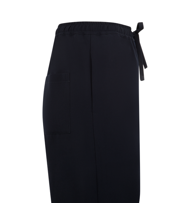 Image 3 of 3 - NAVY - THE ROW Orieno Pant featuring relaxed mid-rise pant in structured wool gabardine with straight leg, side seam pockets and drawstring waist. 100% wool. Made in Italy.